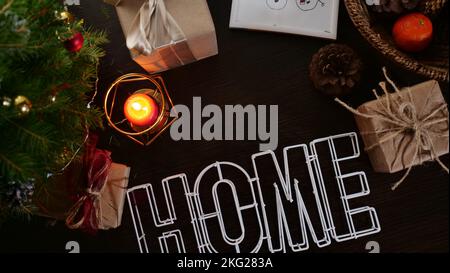 New Year's flatley layout in the evening at night. Christmas canoon at home with a Christmas tree, candles, postcards, handouts, tangerines. Space for text Stock Photo