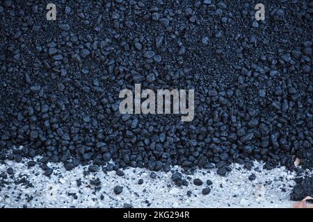 bluish-black asphalt on the ground outdoors Stock Photo