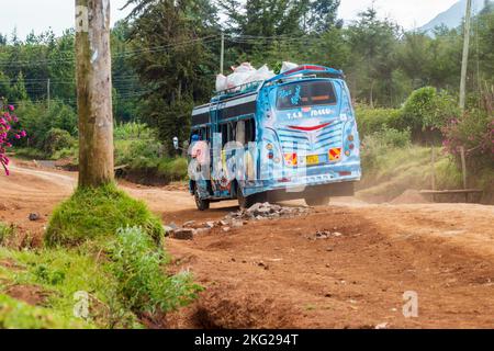 A public transport bus on a dirt road at Kipipiri, rural Kenya Stock Photo