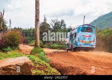 A public transport bus on a dirt road at Kipipiri, rural Kenya Stock Photo
