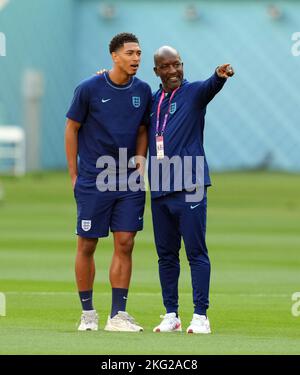 England's Jude Bellingham with coach Chris Powell ahead of the FIFA World Cup Group B match at the Khalifa International Stadium, Doha. Picture date: Monday November 21, 2022. Stock Photo