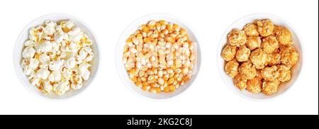 Popcorn, unpopped, popped and caramel coated, in white bowls. Butterfly shaped popcorn, orange corn seeds, and mushroom shaped caramel popcorn. Stock Photo