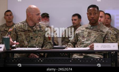 U.S. Army Lt. Col. Ian J. Jarvis (Left), 79th Explosive Ordnance Disposal Battalion, 71st Ordnance Group (EOD), briefs U.S. Army Brig. Gen. Daryl O. Hood (Right), commanding general, 20th Chemical, Biological, Radiological, Nuclear, Explosives Command, during Hood’s visit to Fort Riley, Kansas on Oct. 25, 2022. Hood received a brief about current and future operations planned for the 79th EOD Bn., 71st EOD. Stock Photo