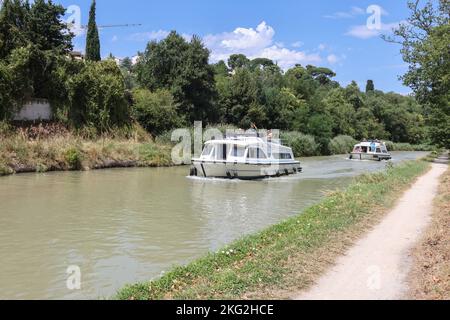 Boat,boats,sail,sailing,pleasure,craft,on,Canal du Midi,popular,leisure,activity,at,in,Carcassonne,Aude,Occitanie,south of France,France,French,Europe,European,August,summer, Stock Photo