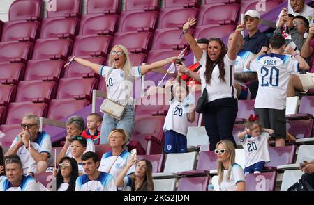 Rebecca Cooke, girlfriend of England's Phil Foden, with son Ronnie Foden in the stands before the FIFA World Cup Group B match at the Khalifa International Stadium in Doha, Qatar. Picture date: Monday November 21, 2022. Stock Photo