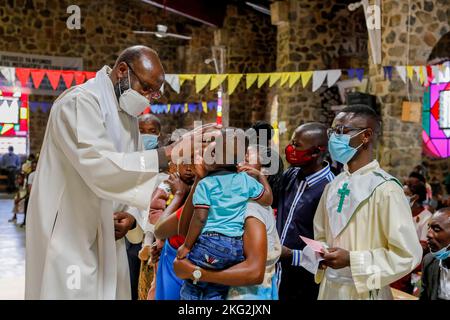 Sunday mass with baptisms in Karongi Genocide Memorial church, Kibuye, western Rwanda Stock Photo