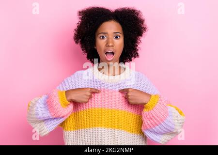 Portrait of stressed dissatisfied girl with wavy hairstyle dressed knit pullover directing at herself isolated on pink color background Stock Photo