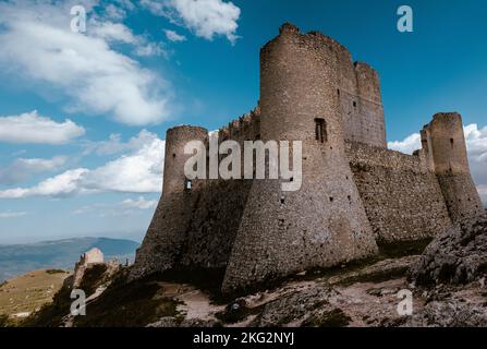 The Rocca Calascio on a hill under a blue cloudy sky in Abruzzo, Italy Stock Photo