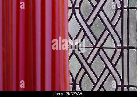 Old window with  red curtain in castle. Stock Photo