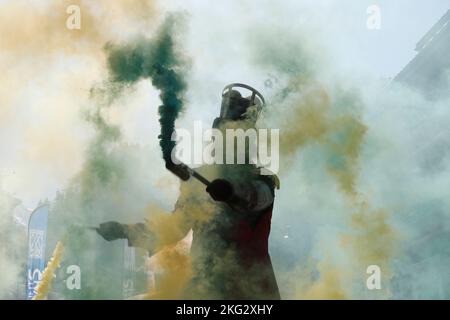 Street artist using colored  smoke bombs.  France. Stock Photo