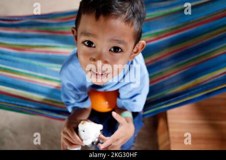 Daily life. Cambodian child  living in a poor district.  Portrait.  Phnom Penh. Cambodia. Stock Photo