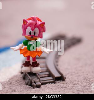 An Amy Rose toy model figure on a train track from the Sonic series Stock  Photo