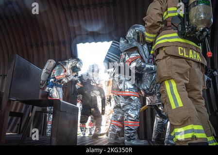 A Japanese Air Self-Defense Force firefighter carries out a simulated victim during a bilateral training with the 374th Civil Engineer Squadron at Yokota Air Base, Japan, Oct. 26, 2022. Thirty-five JASDF members from six different bases gathered at Yokota AB to train and gain experience with 374 CES firefighters. Stock Photo