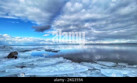 Ice frozen river and beautiful sky. Stock Photo