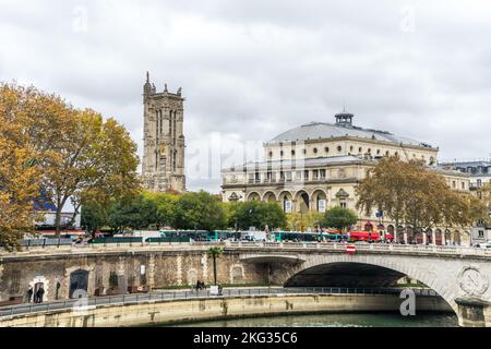 The Saint-Jacques tower, The Theatre de la Ville and Pont au Change bridge over the Seine river. Stock Photo