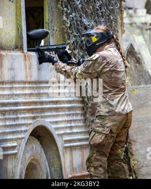 U.S. Army 1st Lt. Molly Murphy targets the simulated enemy with her paintball gun during a react to contact event as part of Medical Readiness Command, Pacific's Fiscal Year 2023 Best Medic Competition, Oct. 27, 2022 at Joint Base Lewis-McChord, Wash. Eight top Soldiers from across MRC,P competed in ten events over three days including a 15-mile ruck march, water survival tests, marksmanship, combat casualty care, and more. Stock Photo