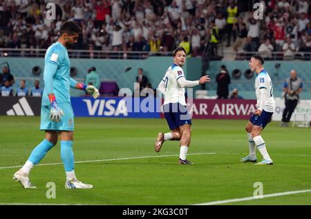 England's Jack Grealish celebrates scoring his sides sixth goal with Phil Foden during the FIFA World Cup Group B match at the Khalifa International Stadium, Doha. Picture date: Monday November 21, 2022. Stock Photo