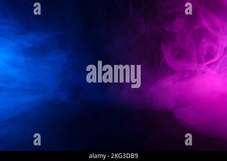 Colorful clouds of smoke in neon light abstract background Stock Photo