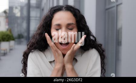Close up Oh my god wow female facial reaction. Amazed excited shocked wonder Caucasian woman girl raising hands in surprise unbelievable news victory Stock Photo