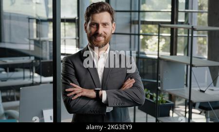 Caucasian 40s middle-aged adult bearded successful boss investor entrepreneur employer business man leader lawyer in office posing confident strong Stock Photo