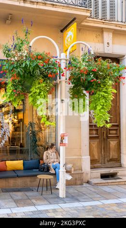 Decorative colourful hanging baskets in the old Town of Toulon, France, November 2022 Stock Photo