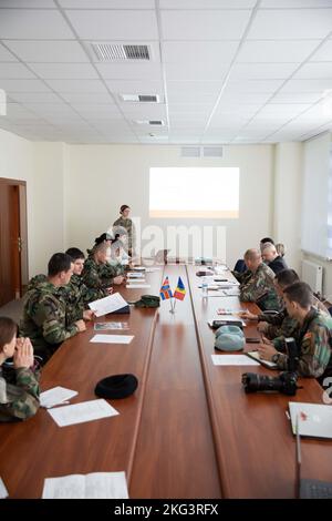 A public affairs officer from U.S. Special Operations Command Europe (SOCEUR) provides training to the Moldovan Mass Media Cell during a subject matter expert exchange (SMEE) in Chisinau, Moldova, Oct. 25, 2022. A team from SOCEUR worked with the Moldovan Mass Media Cell during the SMEE and provided technical training on new camera equipment and training on public affairs operations. AlwaysReady,BetterTogether,Moldova,SOFinEurope,Training, Stock Photo