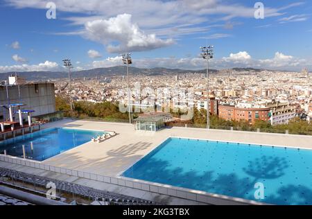 Barcelona Olympic swimming pool with city behind Stock Photo