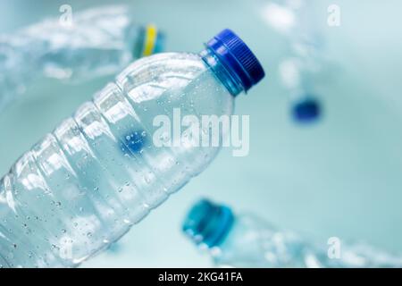 Some plastic bottles on blue background Stock Photo