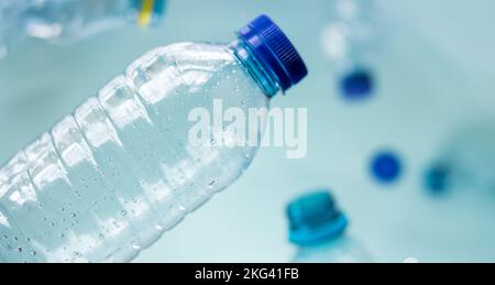Some plastic bottles on blue background Stock Photo