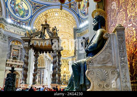 Rome Lazio Italy. Saint Peter's Basilica in Saint Peter's Square. The bronze statue of Saint Peter holding the keys of heaven by Arnolfo di Cambio Stock Photo