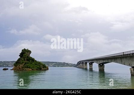 Scenic view of Kouri bridge and a small rocky island at the west side of northern Okinawa, Japan, -16 Stock Photo