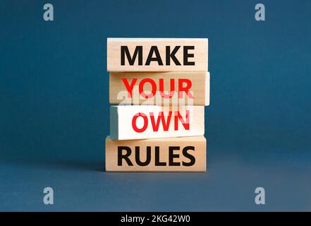 Make your own rules symbol. Concept words Make your own rules on wooden cubes. Beautiful grey table grey background. Business motivational make your o Stock Photo