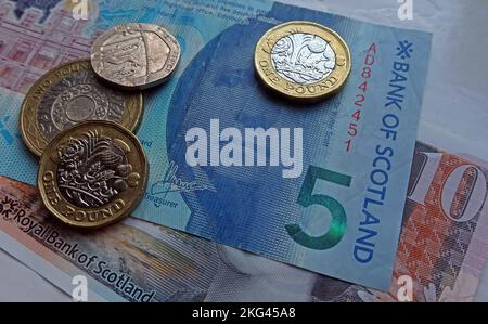 Scottish polymer notes with sterling pound coins, in use in Scotland, UK - five pound, ten pound BOS Bank Of Scotland Stock Photo