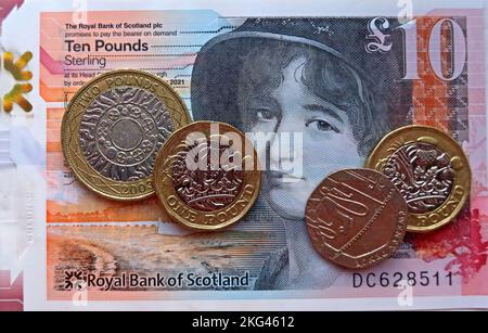 Mary Somerville featured on a Scottish polymer notes with sterling pound coins, in use in Scotland, UK - ten Pound , Royal bank of Scotland Stock Photo