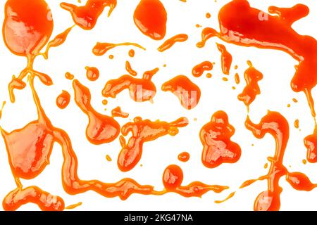 Orange sauce splashes isolated on white a background. Top view. Stock Photo