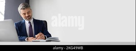 Business Ad. Wide Banner With Handsome Middle Aged Businessman Working In Office Stock Photo