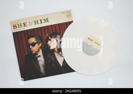 A Very She & Him Christmas is the third studio album by the folk and indie rock band She & Him on vinyl record LP disc, album cover. Zooey Deschanel Stock Photo