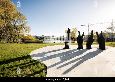 Lviv, Ukraine - October 09, 2022: Metal sculpture of four hands. Looking at their gestures read the letters LVIV. Stock Photo