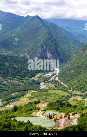 Tskhenistsqali river valley landscape in Racha region of Georgia with Svaneti mountain range, lush green forests and vineyards seen from to Khvamli. Stock Photo