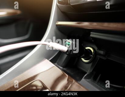 USB port charger for smartphone in a car. Stock Photo