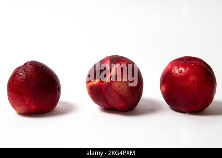 Fresh nectarine peaches on white background Stock Photo