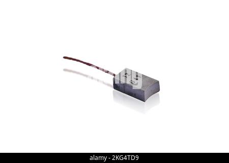 Old carbon brush of automotive generator , object isolated with clipping path on white background Stock Photo