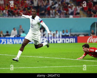 Ar Rayyan, Qatar. Ar Rayyan, Qatar. 21st Nov, 2022. Soccer: World Cup, USA - Wales, Preliminary Round, Group B, Matchday 1, Ahmed bin Ali Stadium, Timothy Weah (l) of USA celebrates his goal to make it 1-0. Neco Shay Williams of Wales is on the right. Credit: Tom Weller/dpa/Alamy Live News Credit: dpa picture alliance/Alamy Live News Stock Photo