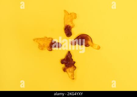 Two colored gummy candies on yellow background Stock Photo