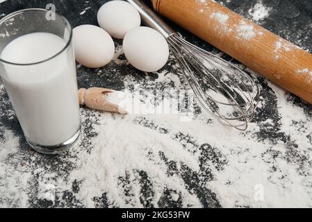 Dough background. Fresh dough with various ingredients on a wooden table Stock Photo