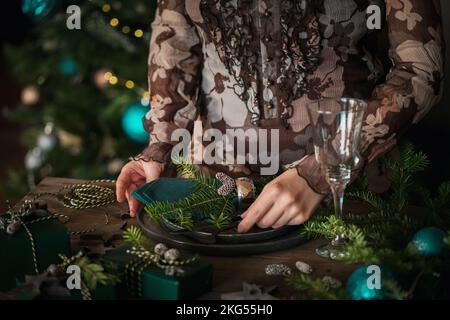 Woman preparing festive place setting Stock Photo