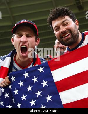 Ar Rayyan, Qatar. 21st Nov, 2022. Soccer: World Cup, USA - Wales, preliminary round, Group B, Matchday 1, Ahmed bin Ali Stadium, US fans cheer with a flag before the start of the match. Credit: Tom Weller/dpa/Alamy Live News Stock Photo