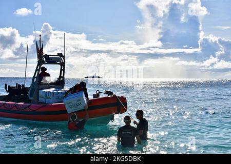 The crew USCGC Oliver Henry (WPC 1140) visit Ulithi Atoll on Oct. 31, 2022, the first time a fast response cutter visited the atoll and delivered 20 boxes of supplies, 50 personal floatation devices, and sporting equipment donated by the cutter crew, the extended U.S. Coast Guard Guam family, Ulithi Falalop Community Action Program, Guam Island Girl Power Foundation, and Ayuda Foundation. Ulithi was a central U.S. staging area during World War II, and home to a U.S. Coast Guard Loran-C communications station from 1944 to 1965 before operations relocated to Yap and ultimately shuttered in 1987. Stock Photo