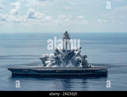 The aircraft carrier USS Gerald R. Ford (CVN 78) successfully completes the third and final scheduled explosive event of Full Ship Shock Trials while underway in the Atlantic Ocean, Aug. 8, 2021. The U.S. Navy conducts shock trials of new ship designs using live explosives to confirm that our warships can continue to meet demanding mission requirements under harsh conditions they might encounter in battle. Stock Photo