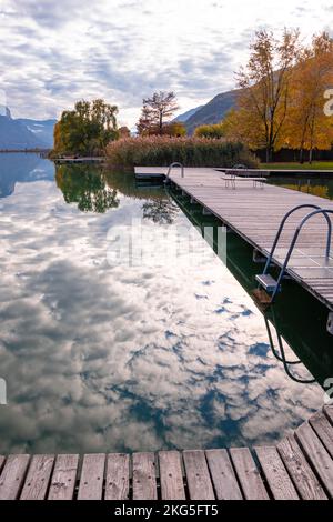 Kaltern, South Tyrol, Italy -14 November 2022 Landing stage at Lake Caldaro, a natural bathing lake on the South Tyrolean Wine Road Stock Photo